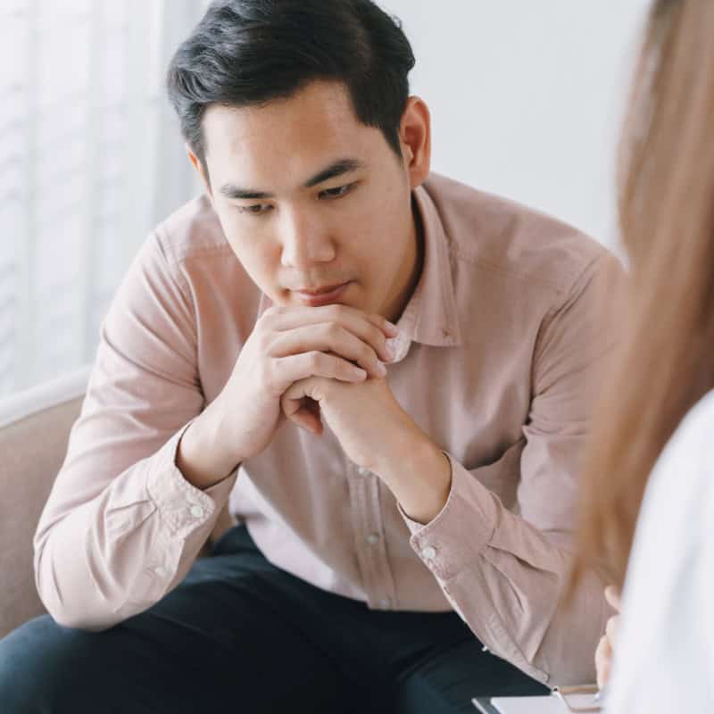 Male Asian Patient With Psychologist