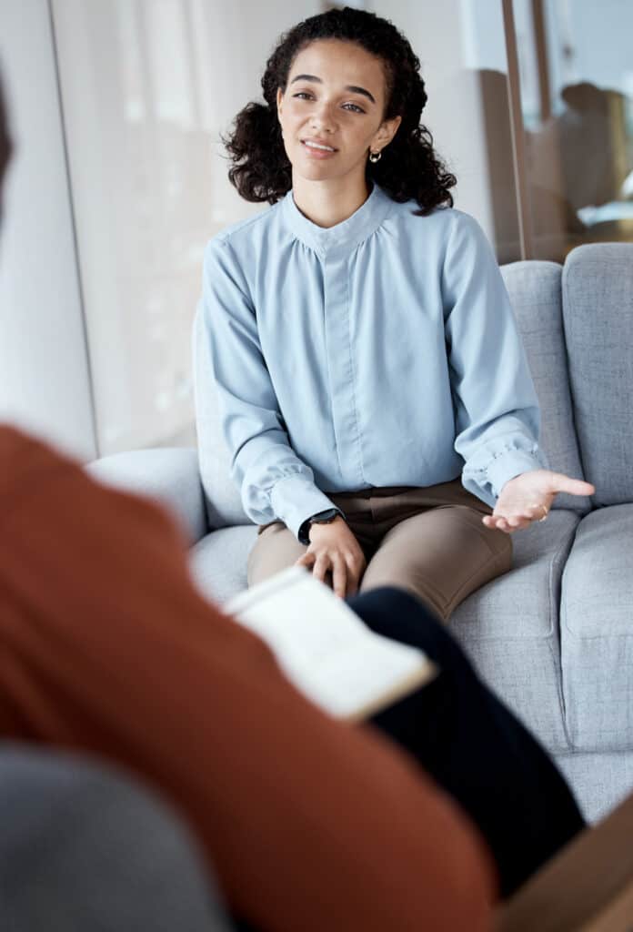 Beautiful Young Woman Discussing With Psychologist